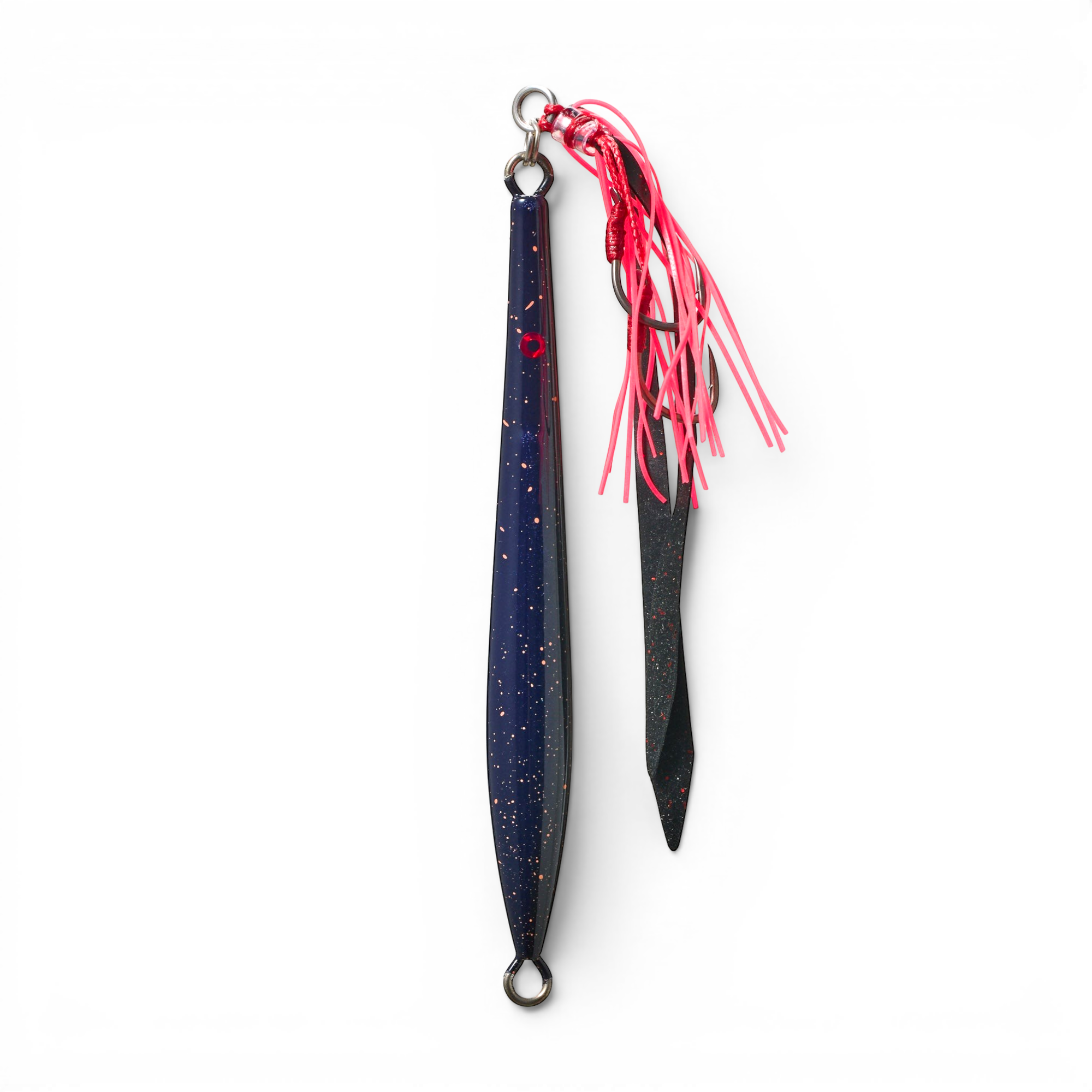 Ocean Angler Fish-Finger metal jig in dark blue with gold speckles, featuring a red assist hook and pink skirt.