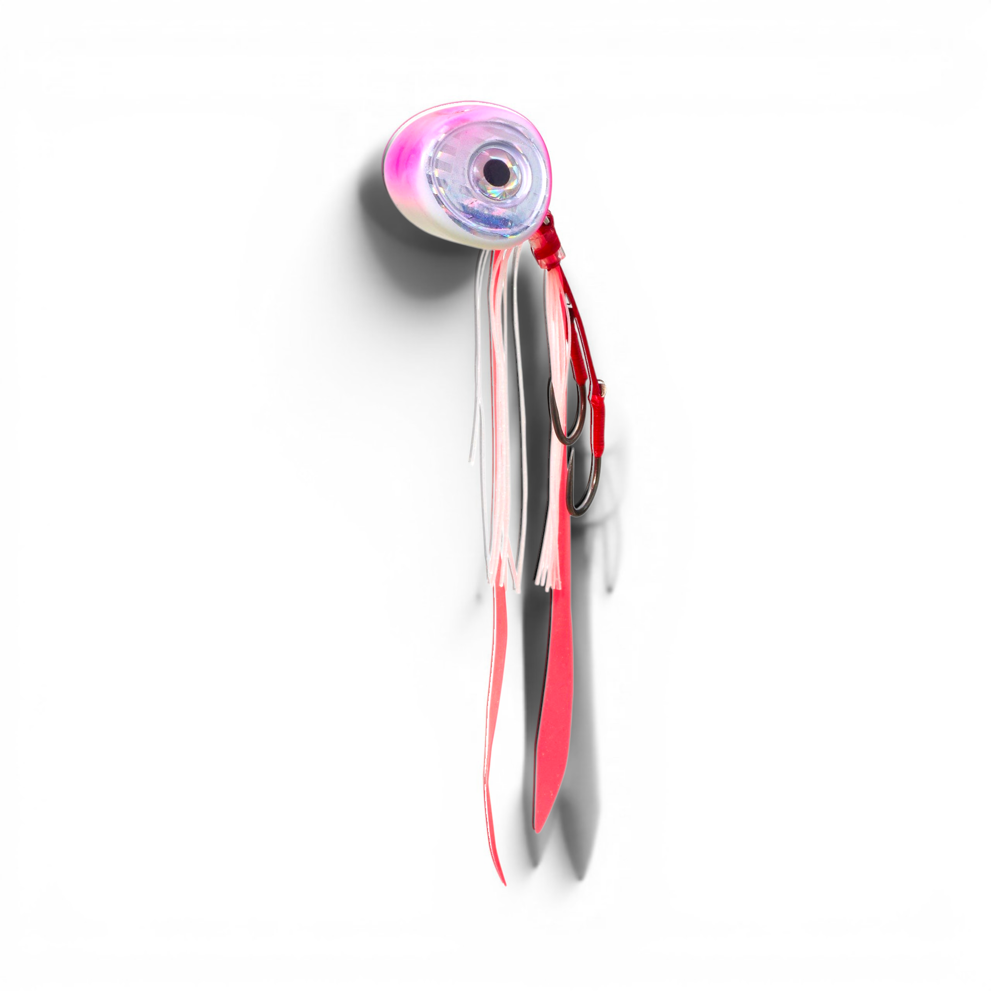Ocean Angler Slider fishing lure with a pink and white weighted head, large reflective eye, and silicone skirt tails.