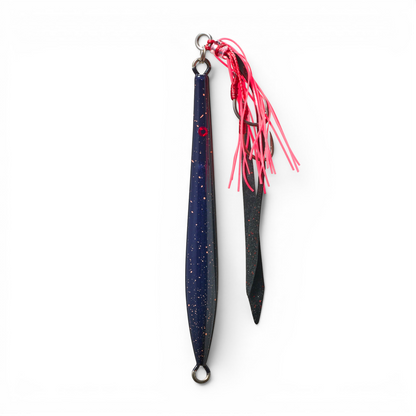 Ocean Angler Fish-Finger metal jig in dark blue with gold speckles, featuring a red assist hook and pink skirt.