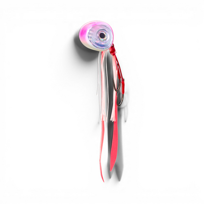 Ocean Angler Slider fishing lure with a pink and white weighted head, large reflective eye, and silicone skirt tails.